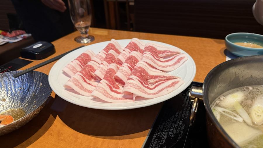 A plate of thinly sliced pork for shabu-shabu
